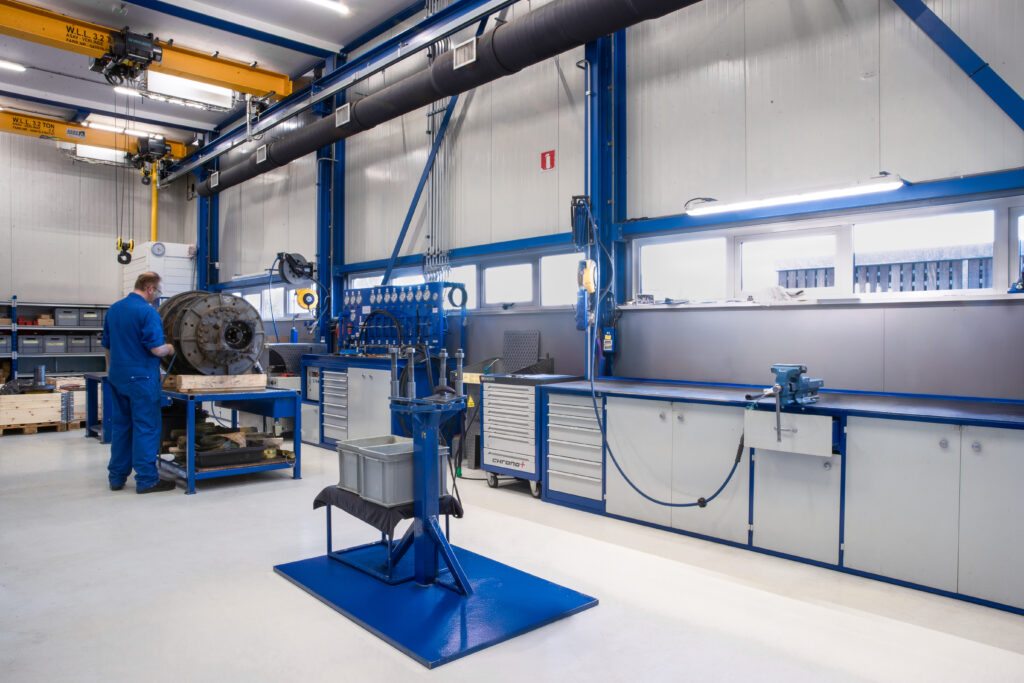 Modern workshop with hydraulic equipment.